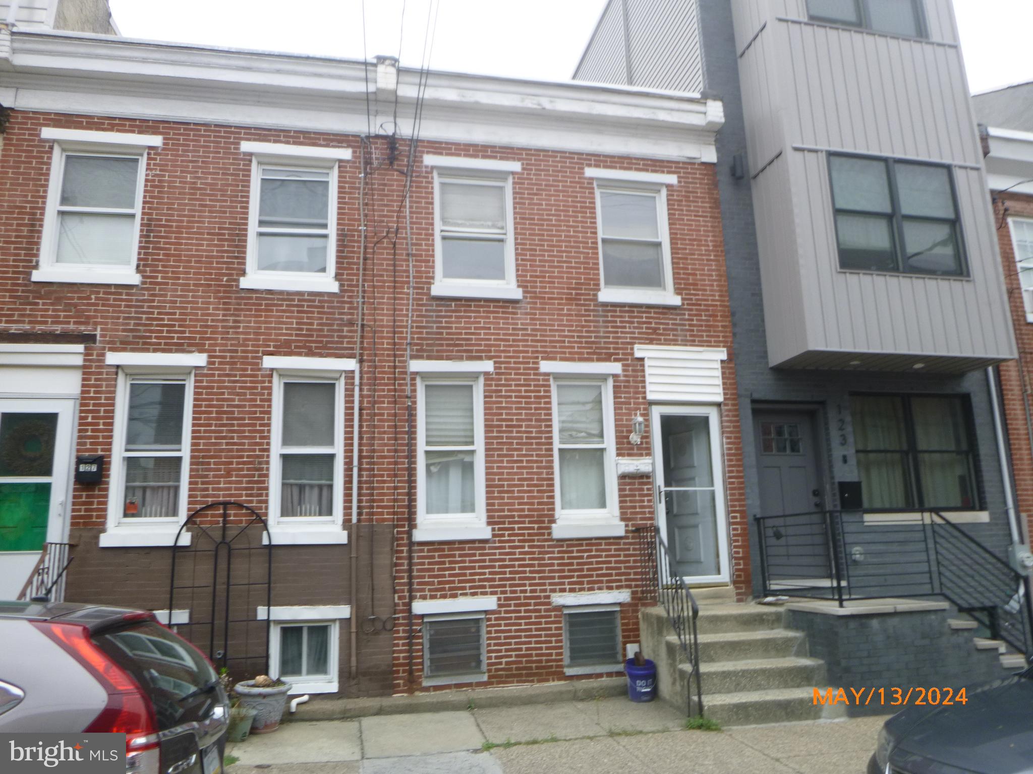 a front view of a brick building with many windows