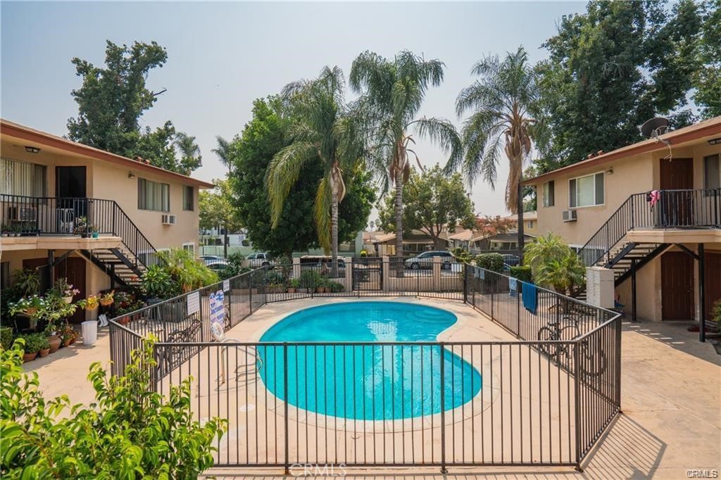 a view of swimming pool with outdoor seating