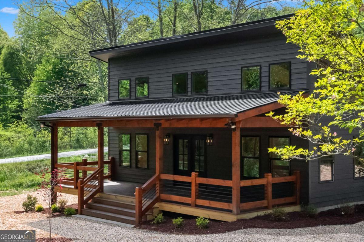 a view of house with a outdoor seating