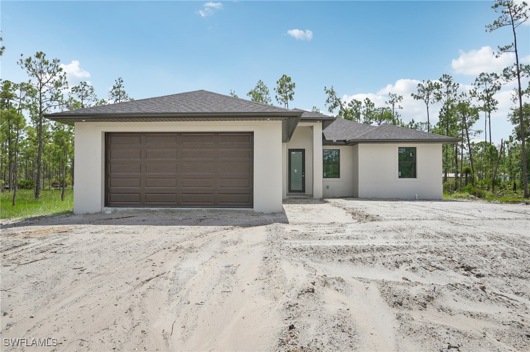 a view of garage and yard