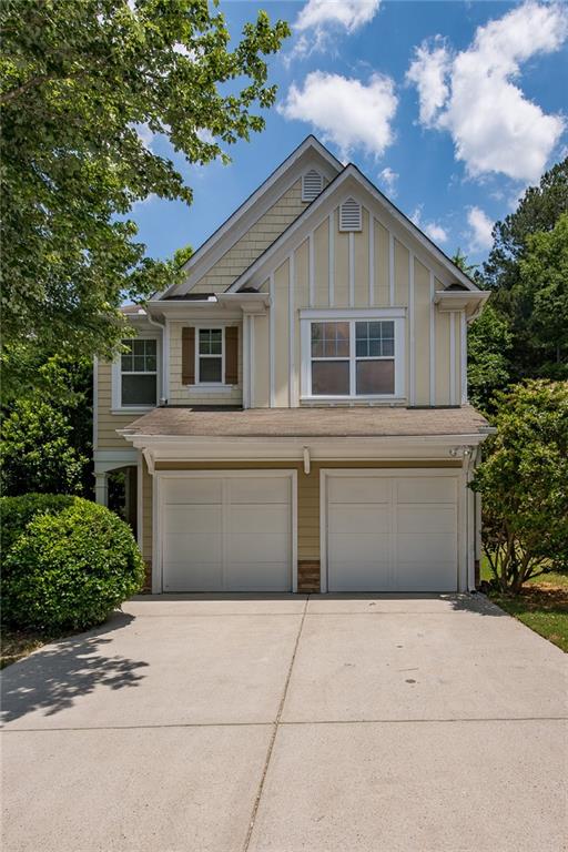 a front view of a house with a garage