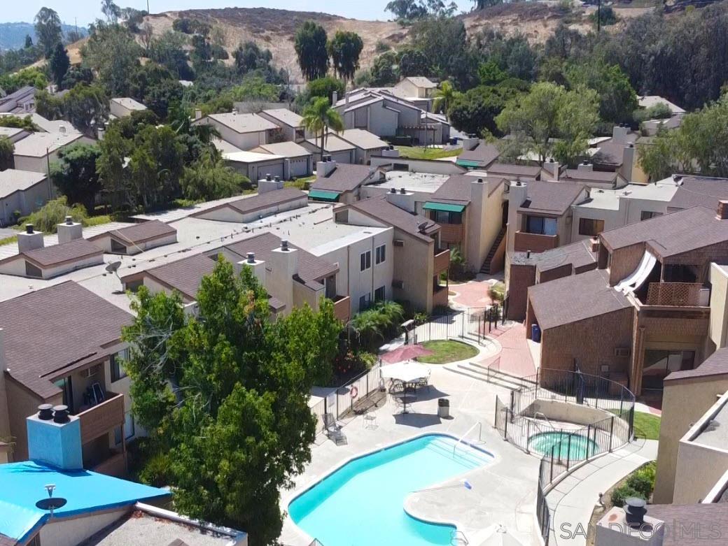 an aerial view of a house with yard swimming pool and outdoor seating