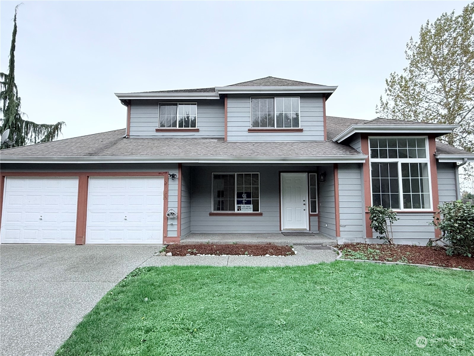 a front view of a house with a yard