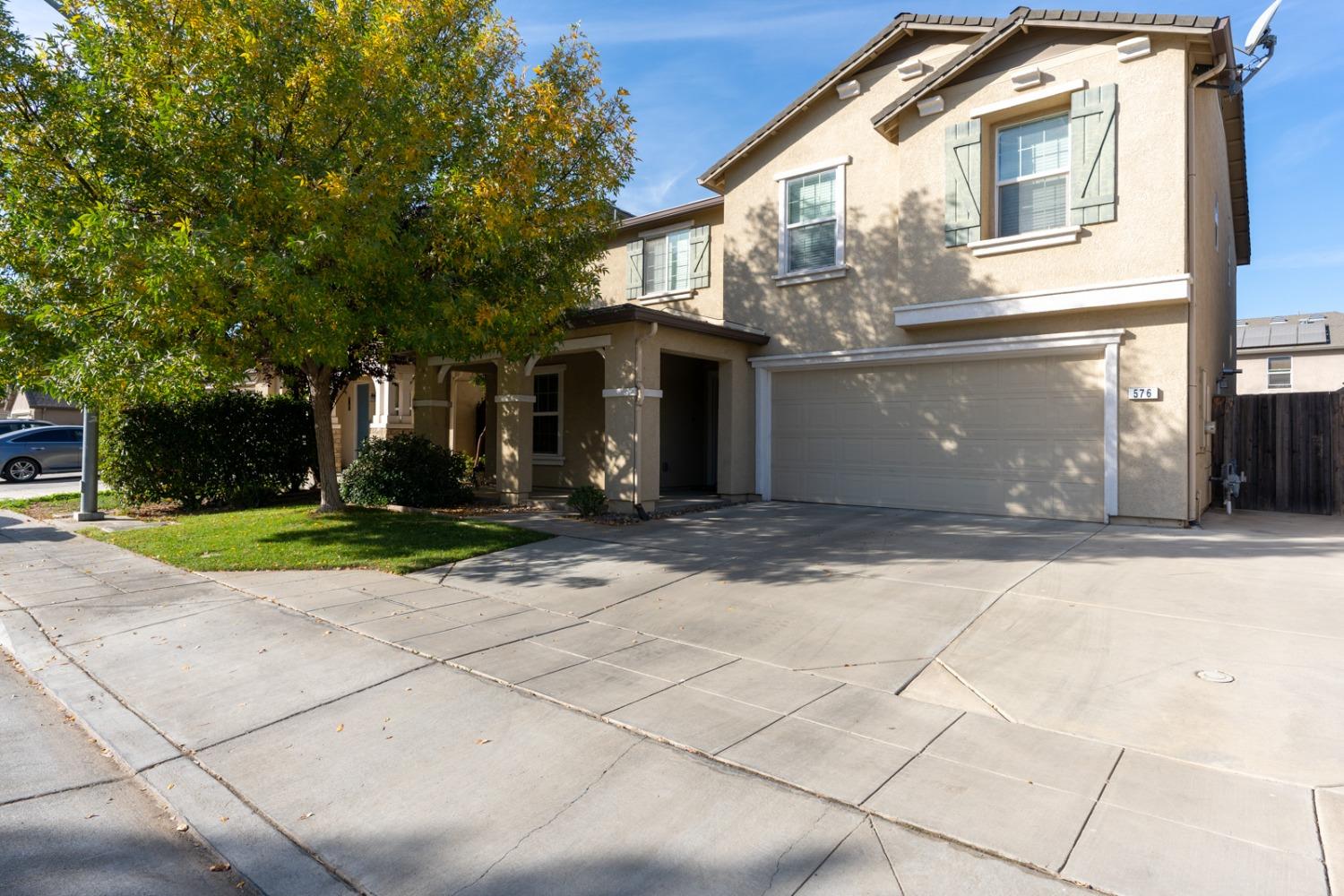 a view of a white house with a outdoor space