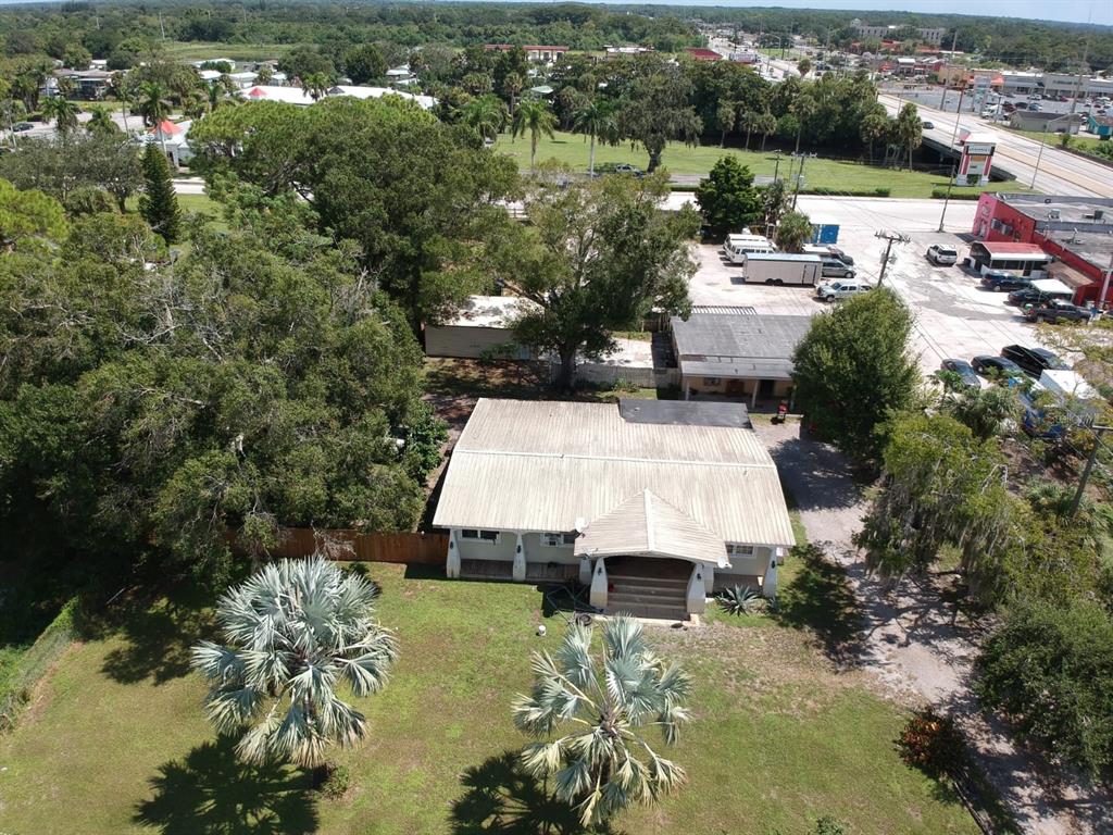 an aerial view of a house with yard swimming pool and outdoor seating