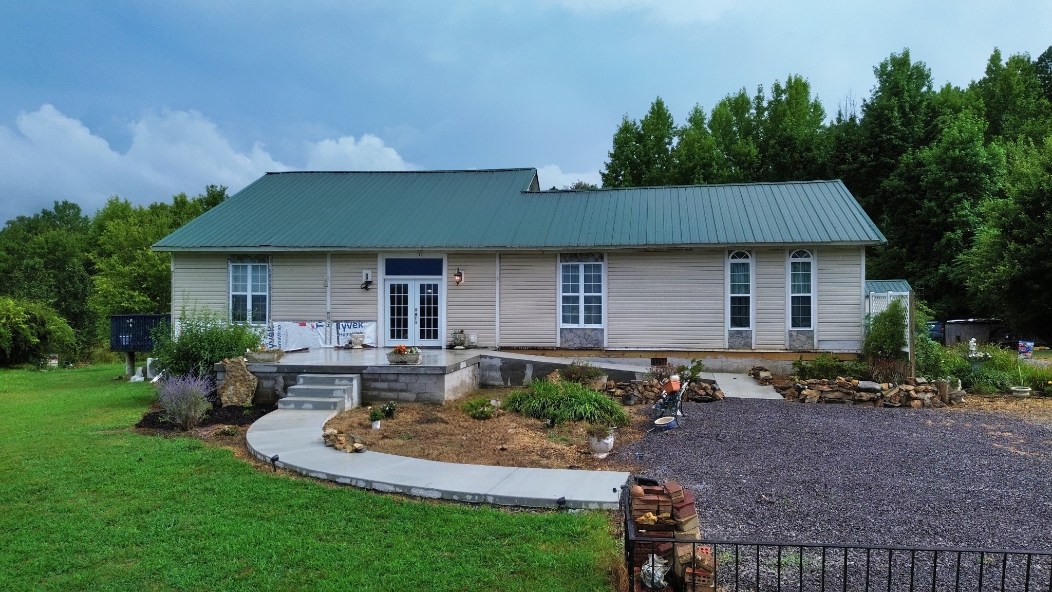 a front view of a house with garden