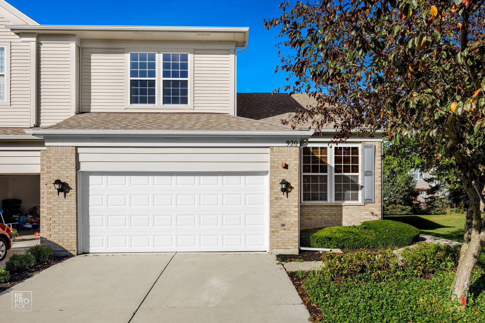 a front view of a house with a garage