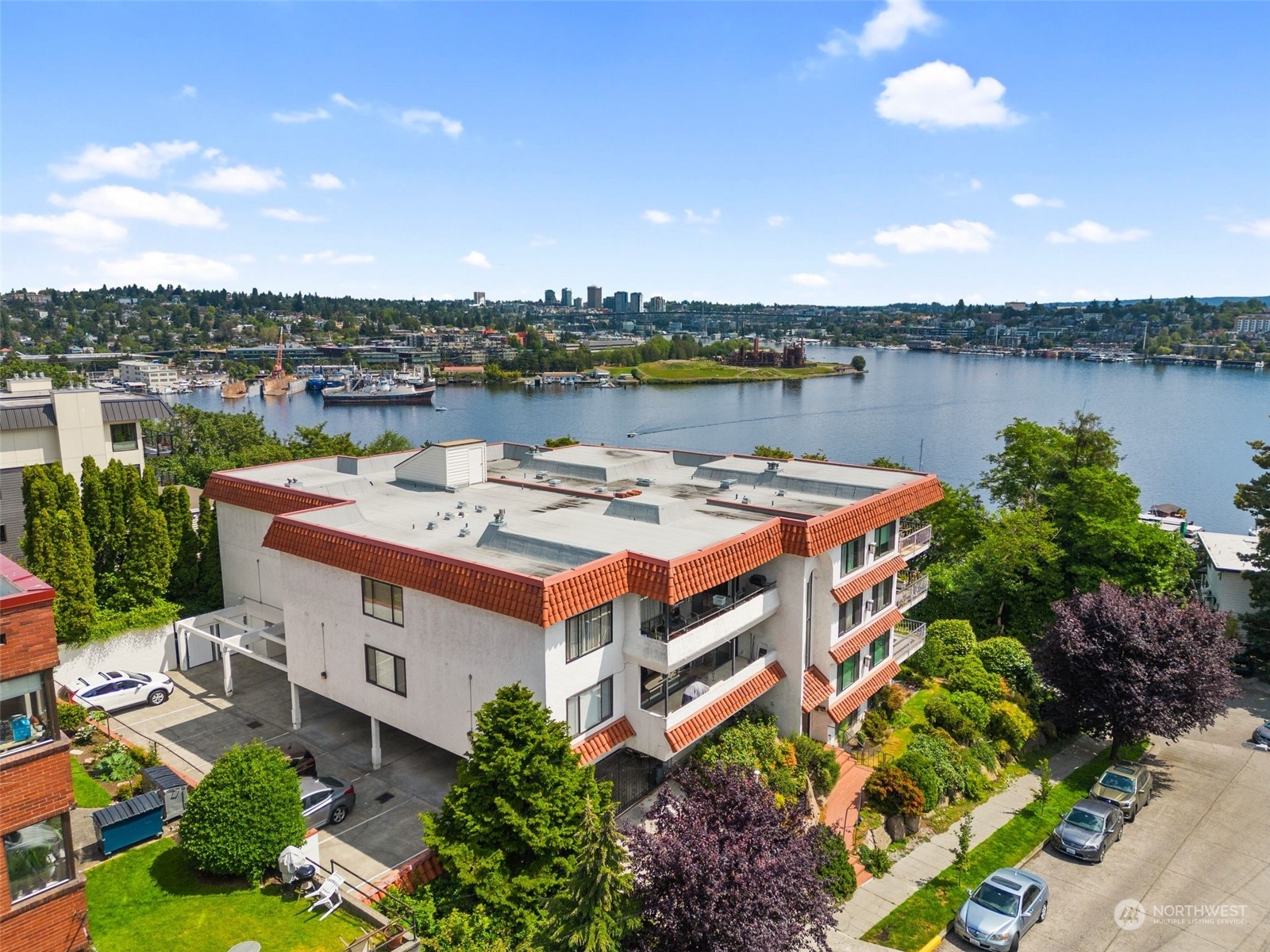 an aerial view of a building with garden space and outdoor seating