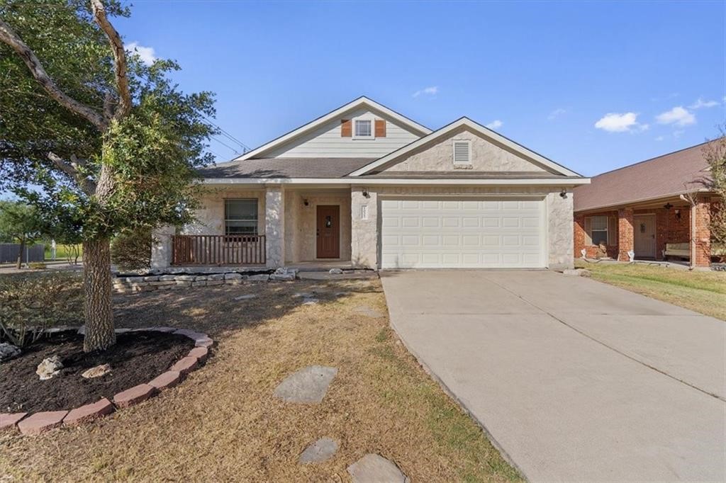 a front view of a house with yard