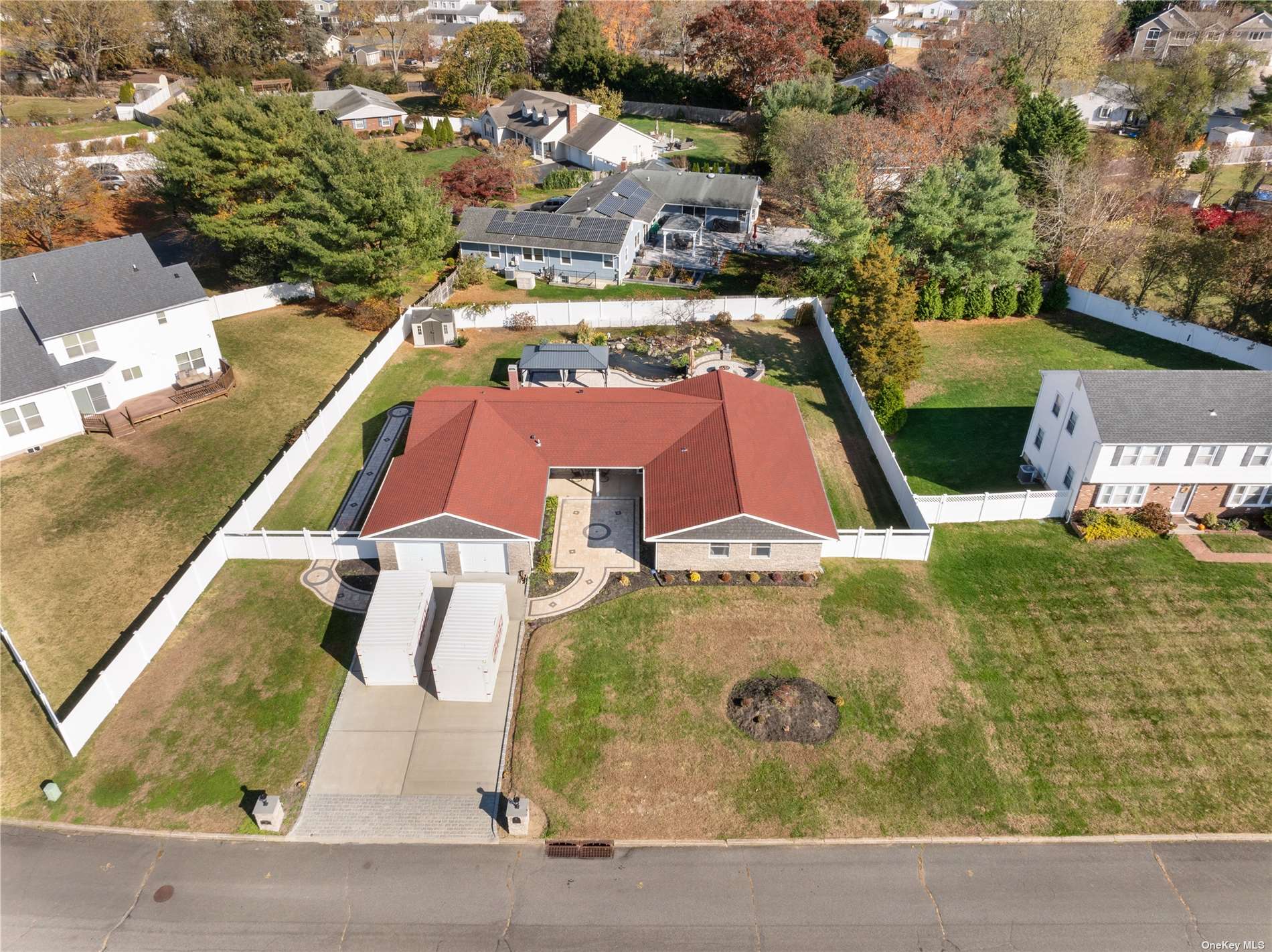 an aerial view of residential houses with outdoor space