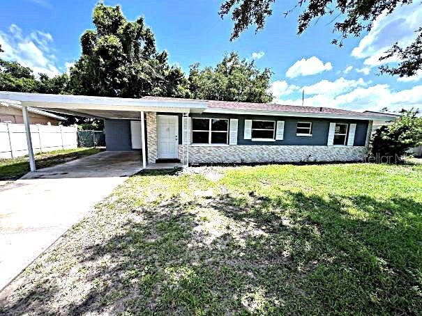 a view of a house with a yard