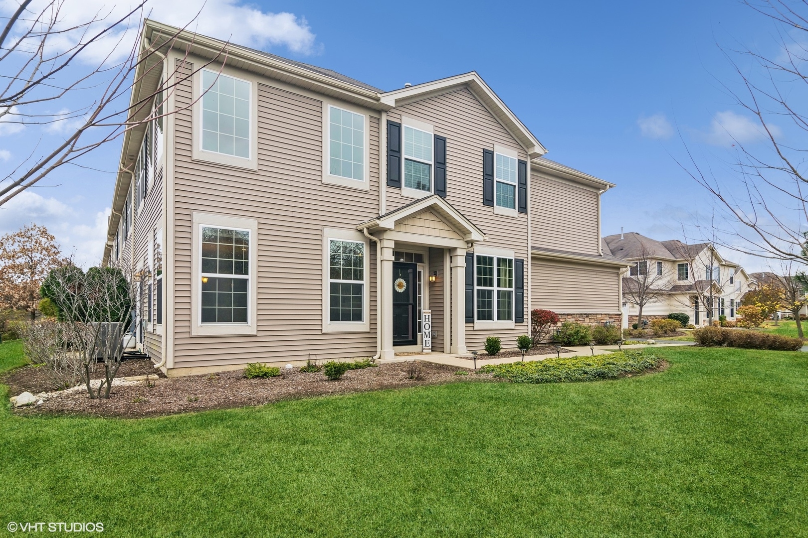 a front view of a house with a yard