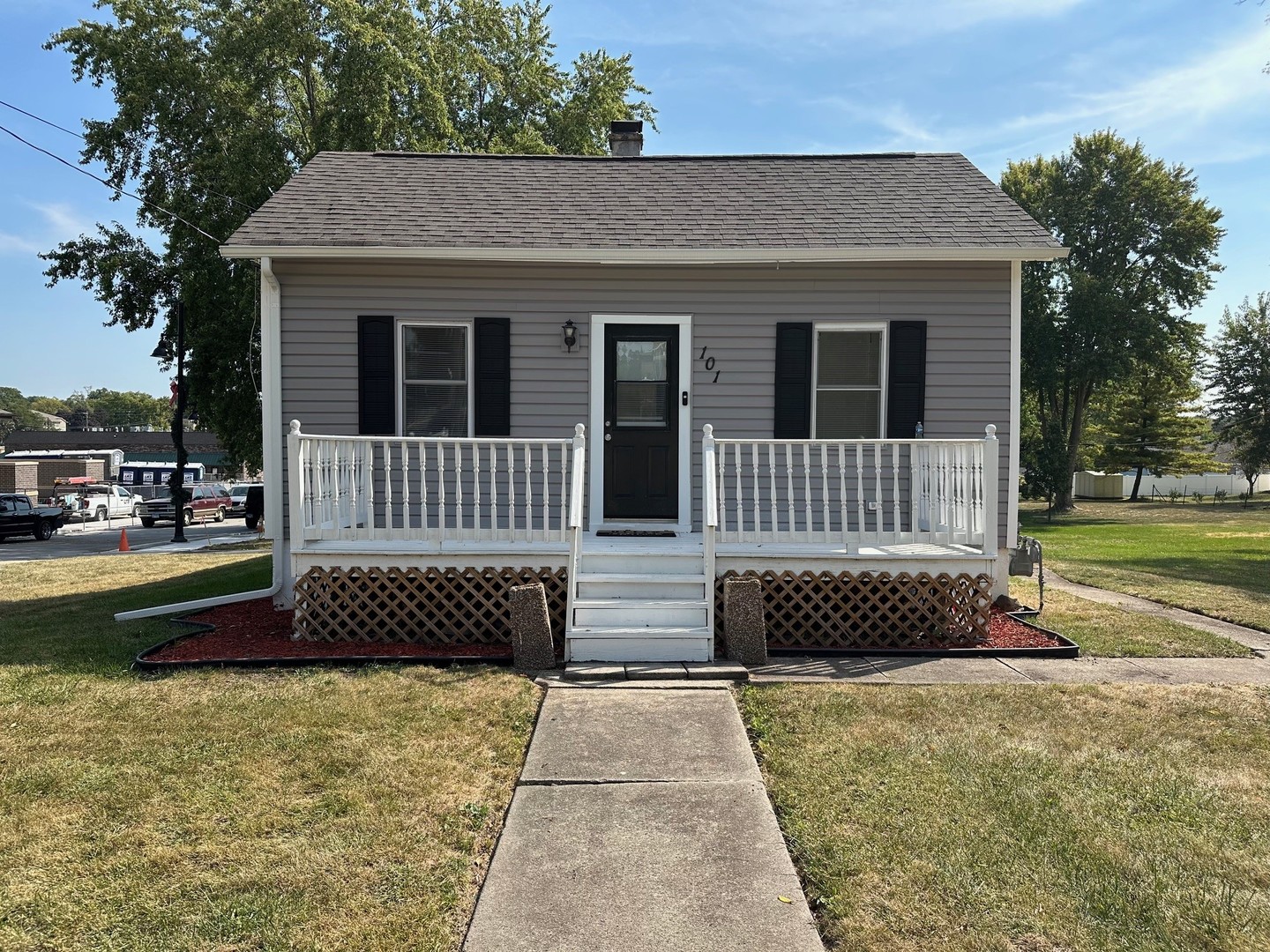 a front view of a house with a garden