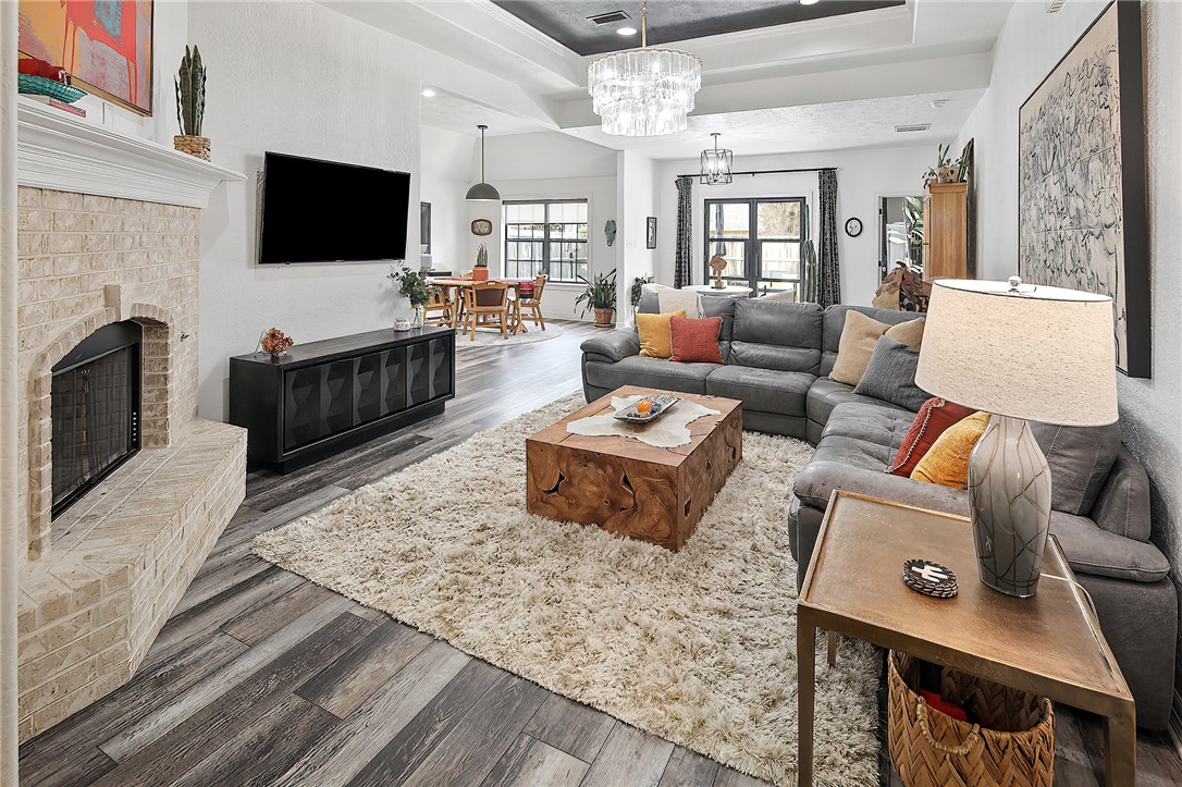 Living room featuring a fireplace, hardwood / wood