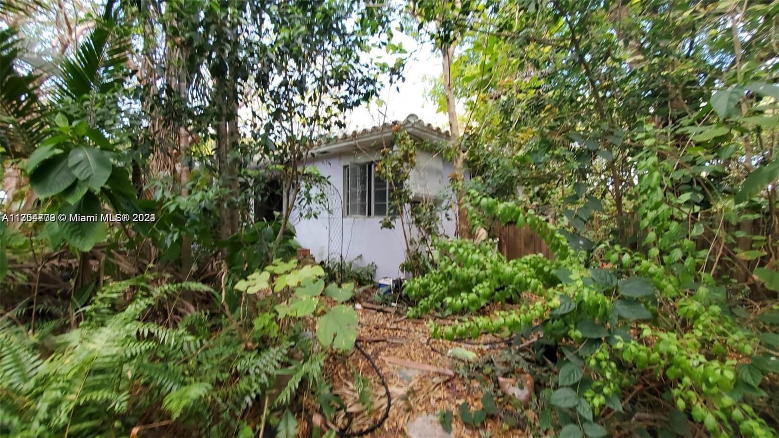 view of a house with a tree