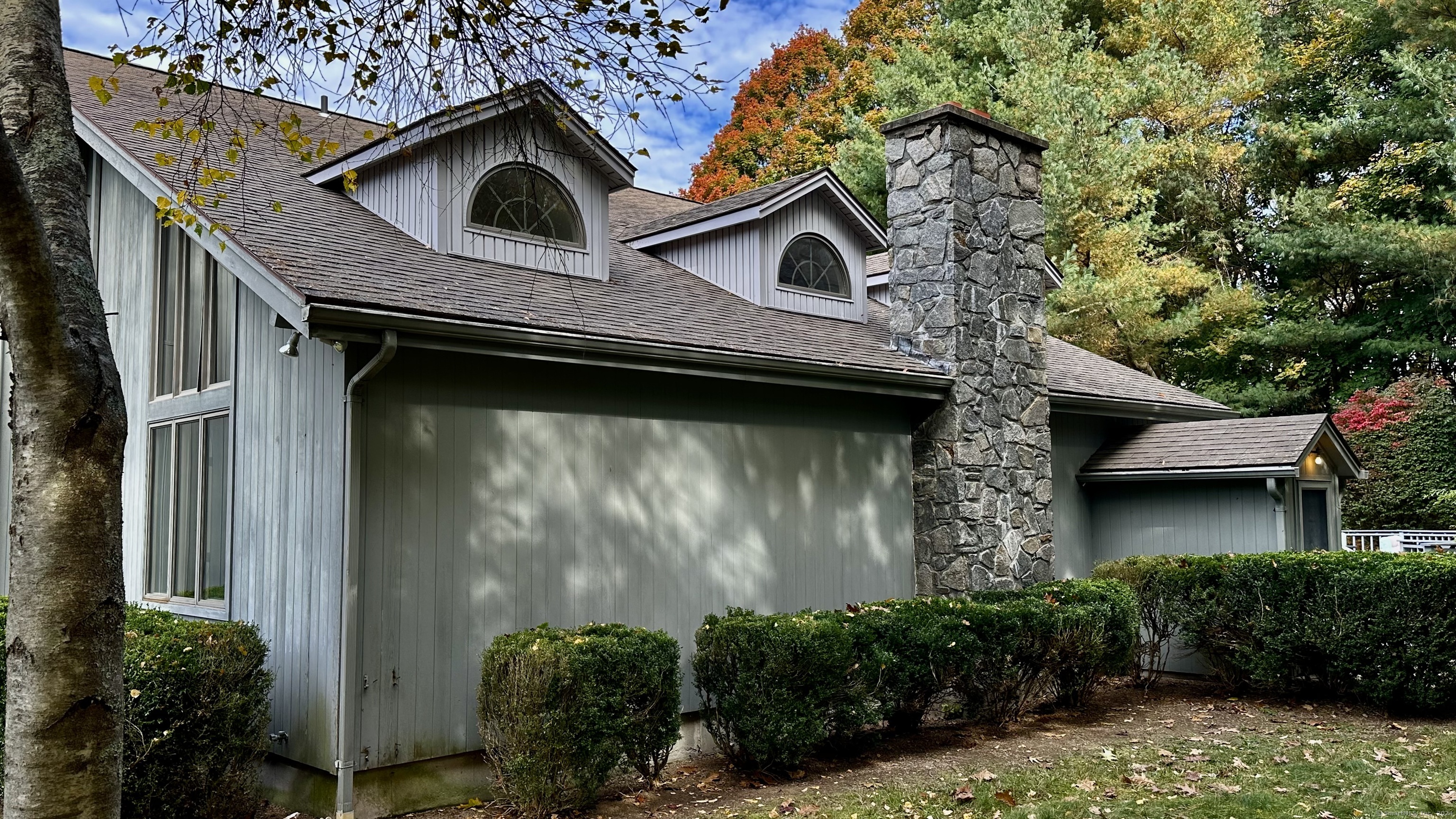 a house with trees in front of it