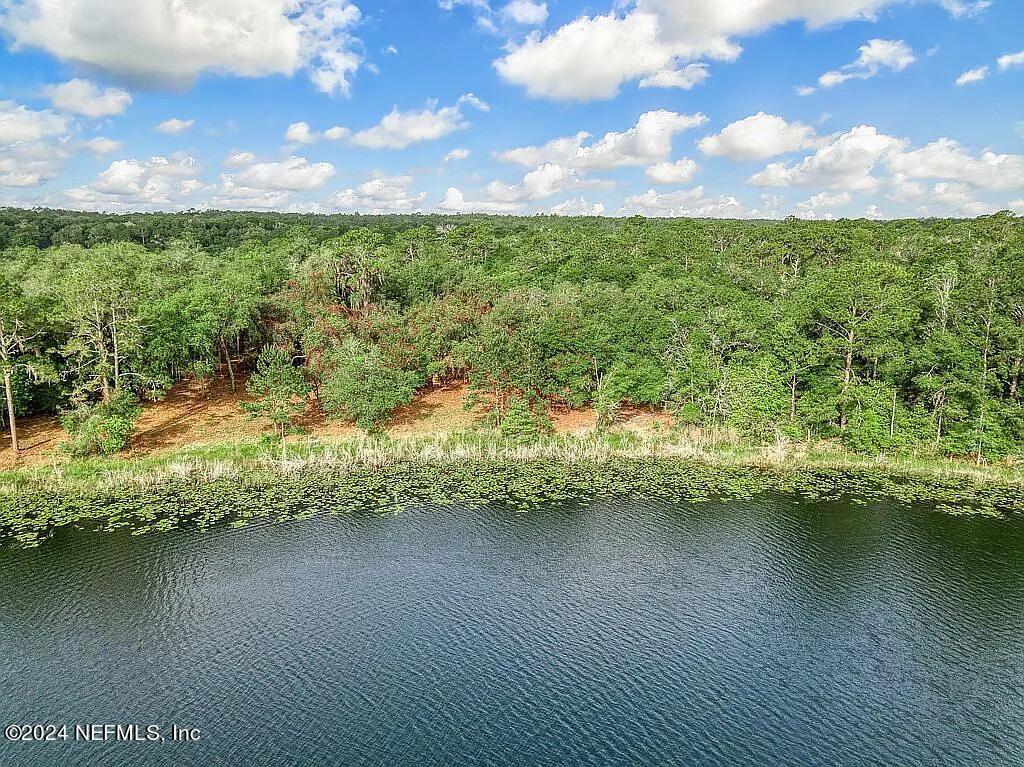 a view of a lake with a yard