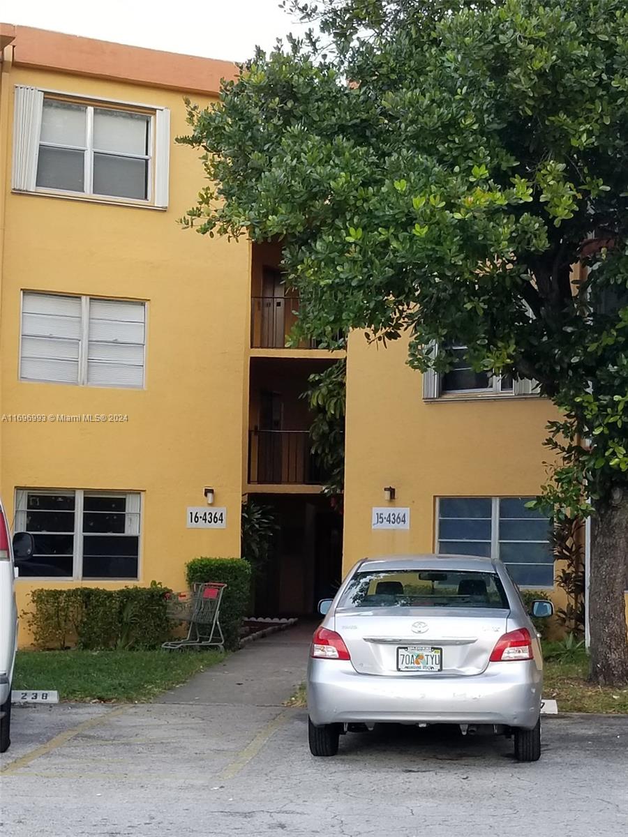 a car parked in front of a house