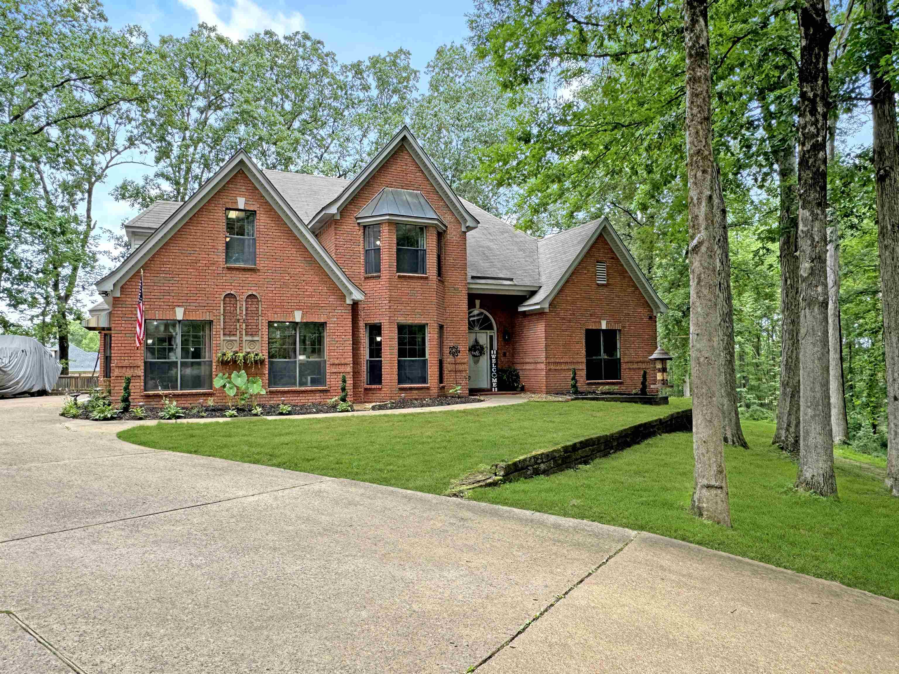 a view of a yard in front view of a house