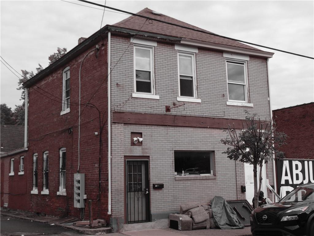 a front view of a house with parking