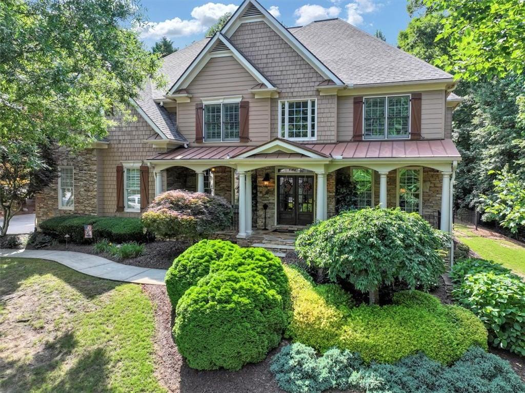 a front view of a house with garden