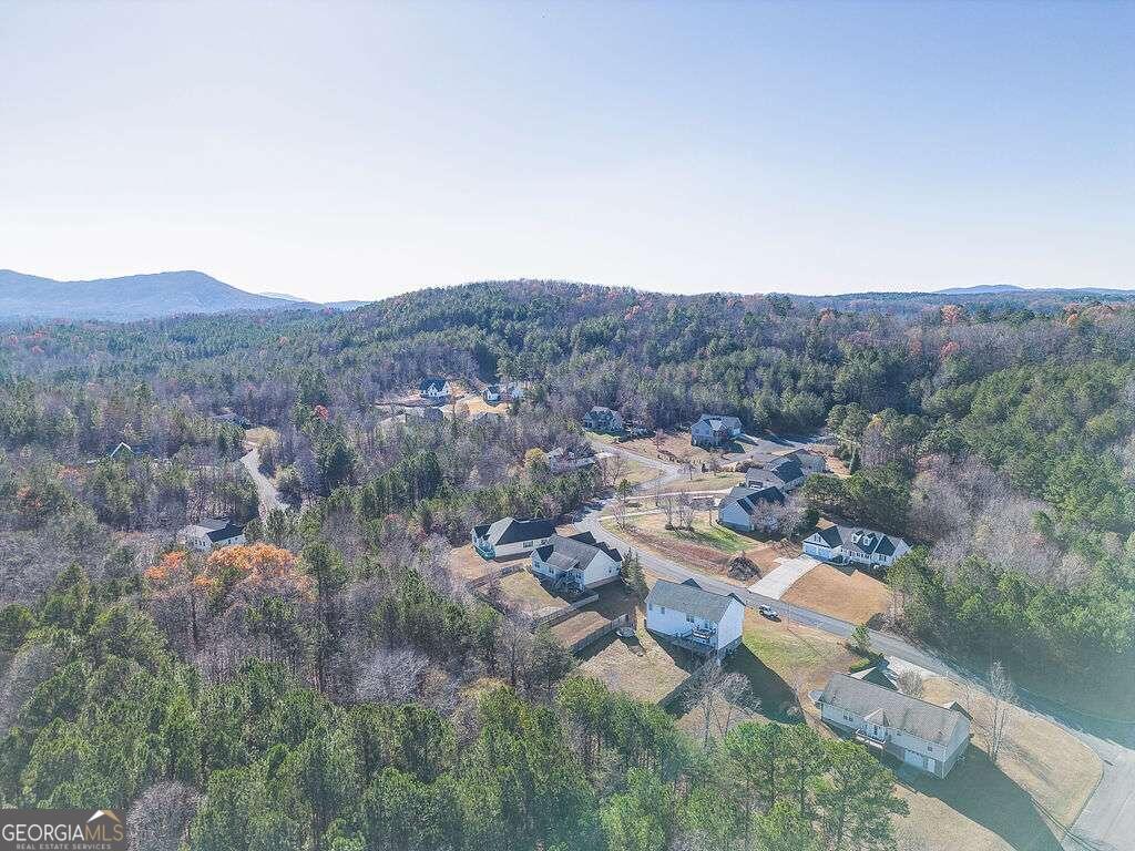 an aerial view of residential house and green space