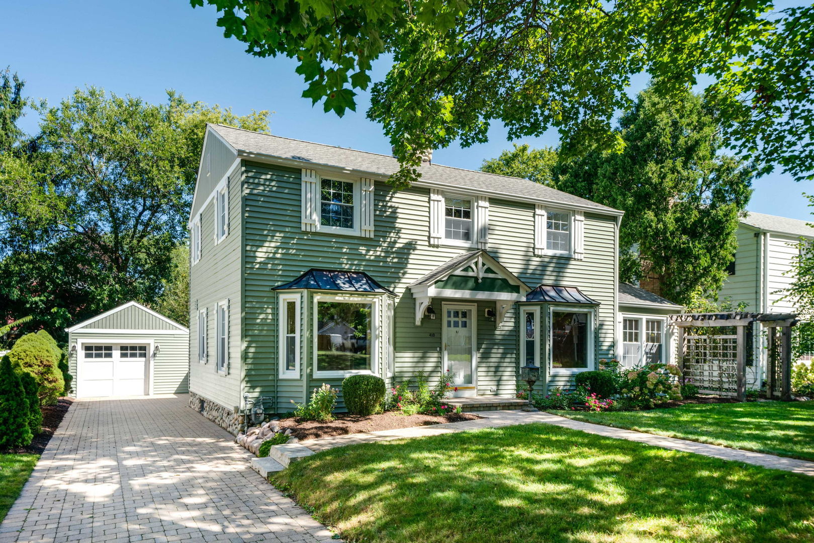 front view of a house with a yard