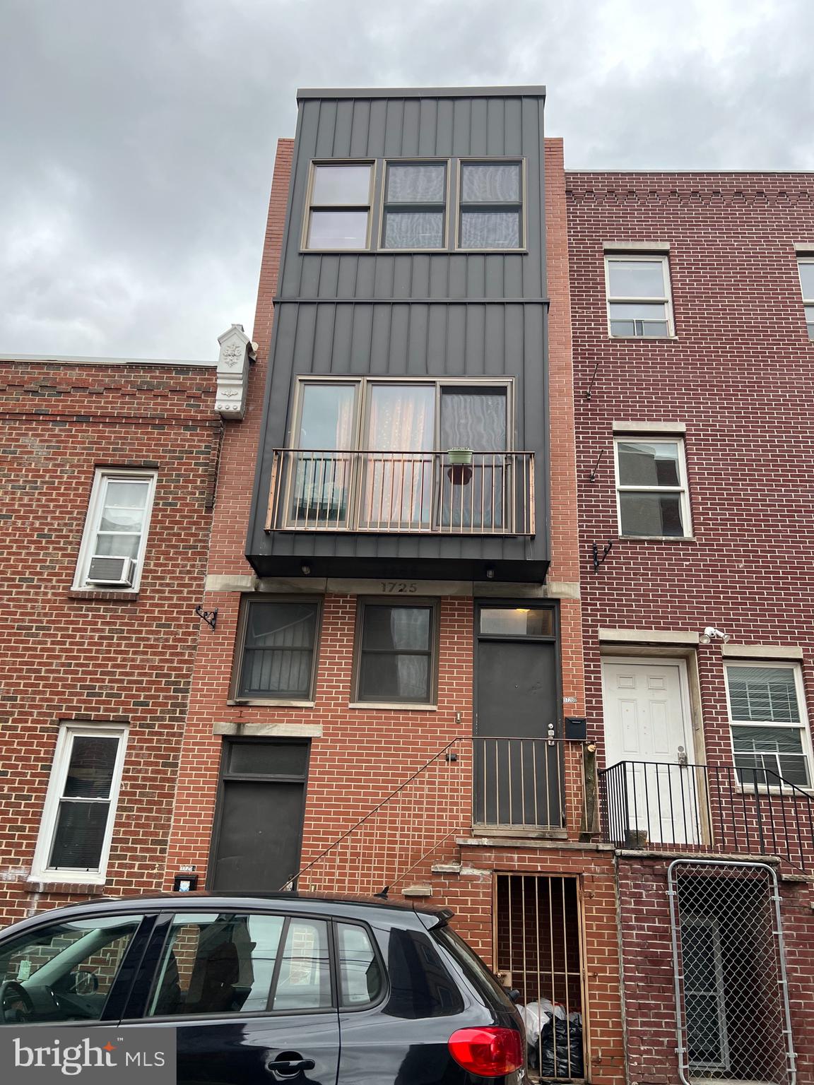 a front view of a building with balcony