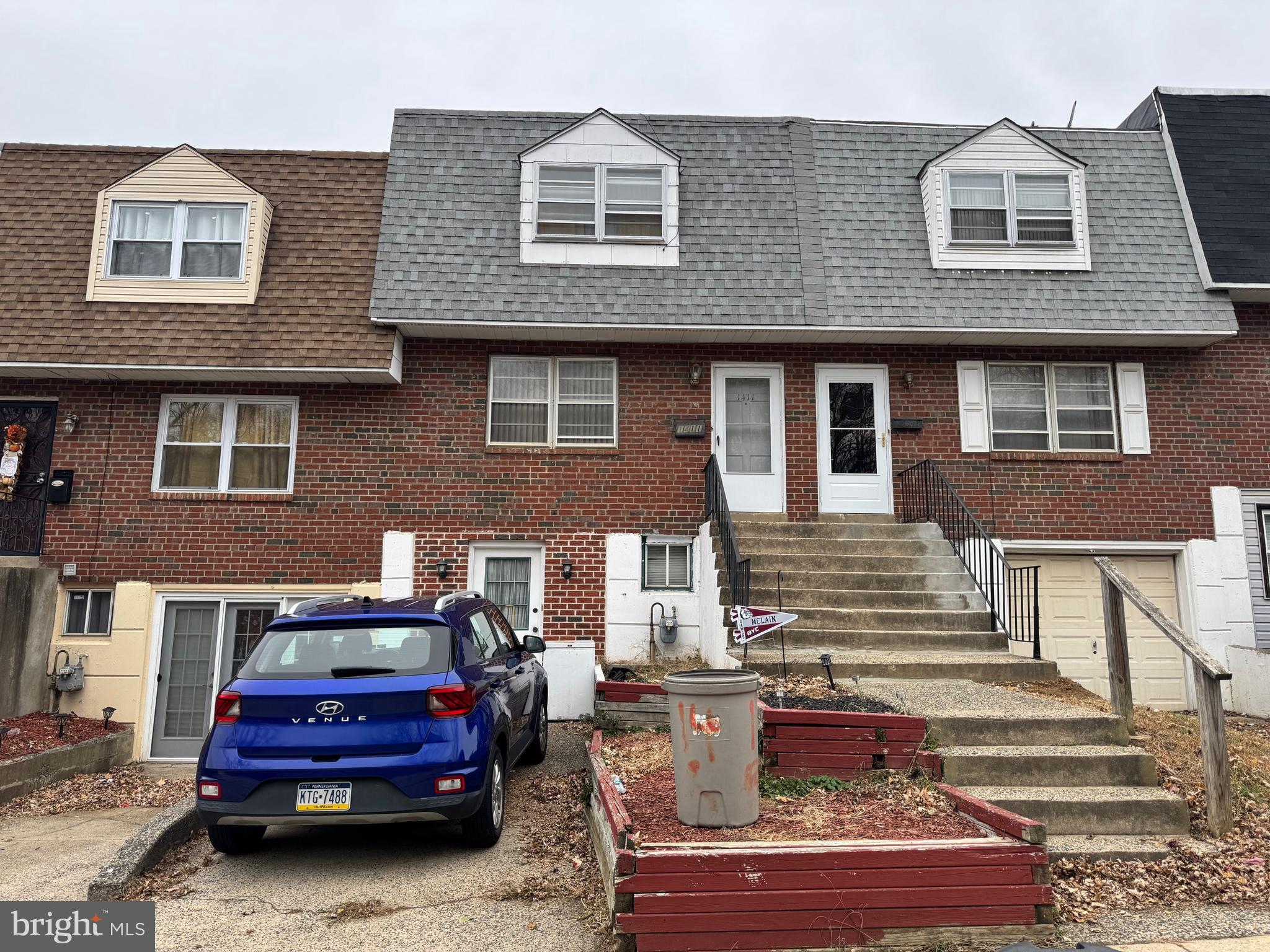 a front view of a house with parking