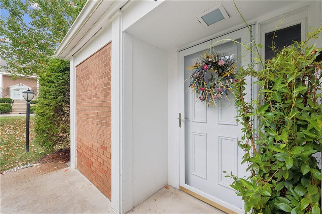 a view of entryway with flower pots