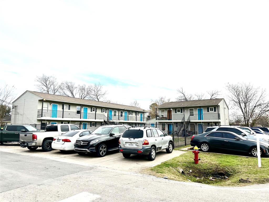 a view of cars parked in front of a house