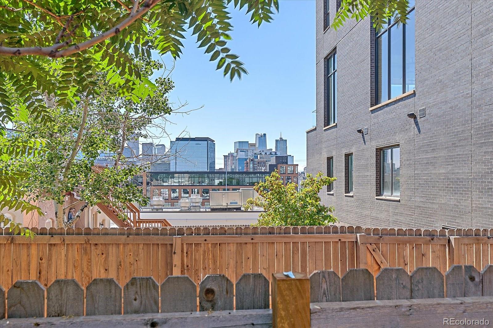 a view of balcony with outdoor seating and wooden floor