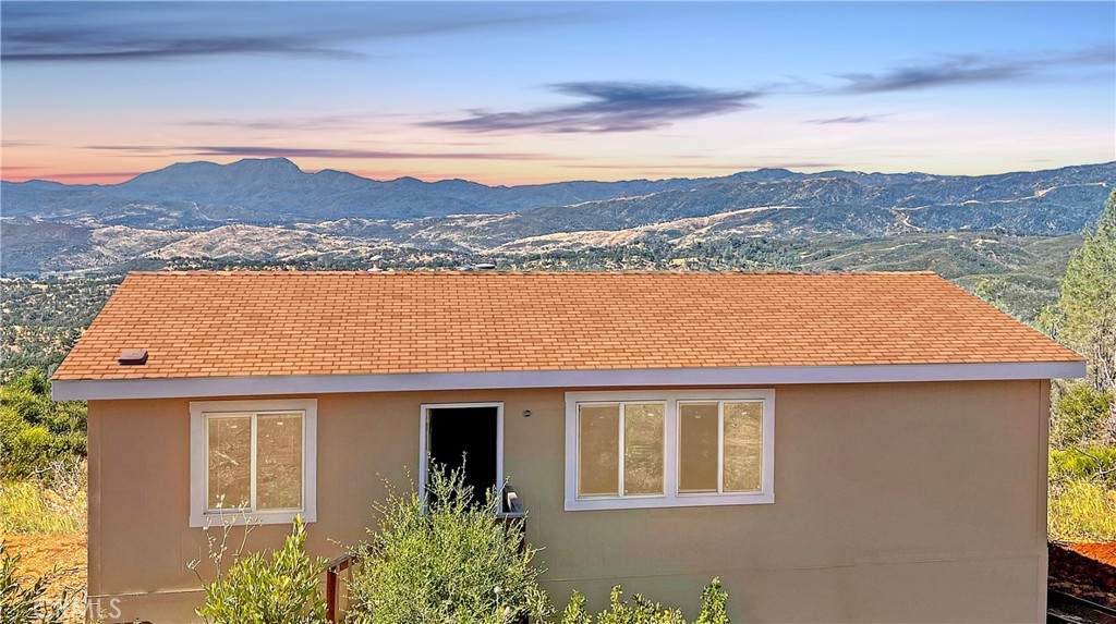 a view of a house with a mountain