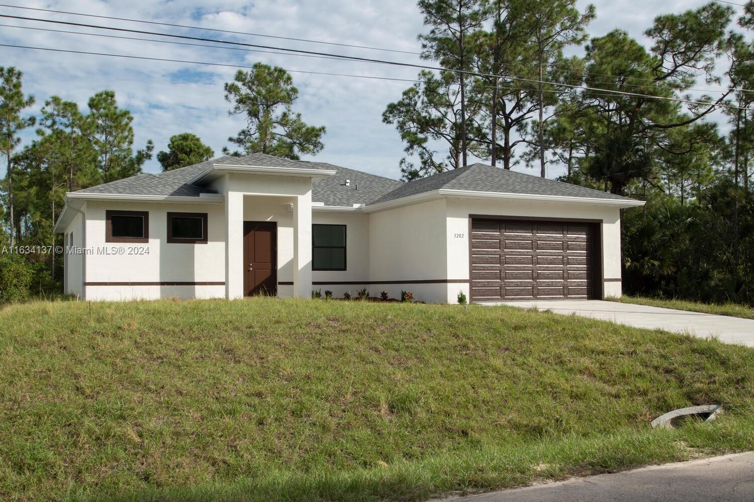 a front view of a house with a garage