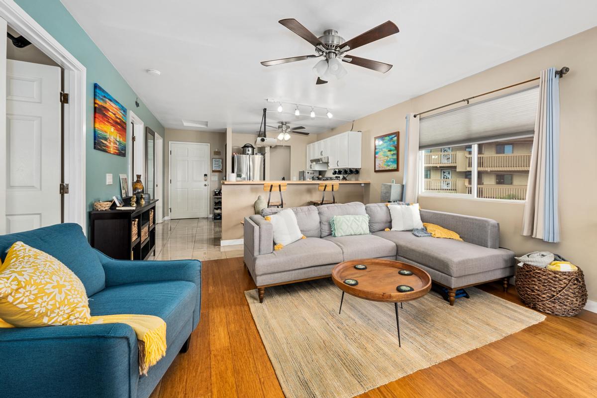 a living room with furniture and a large window