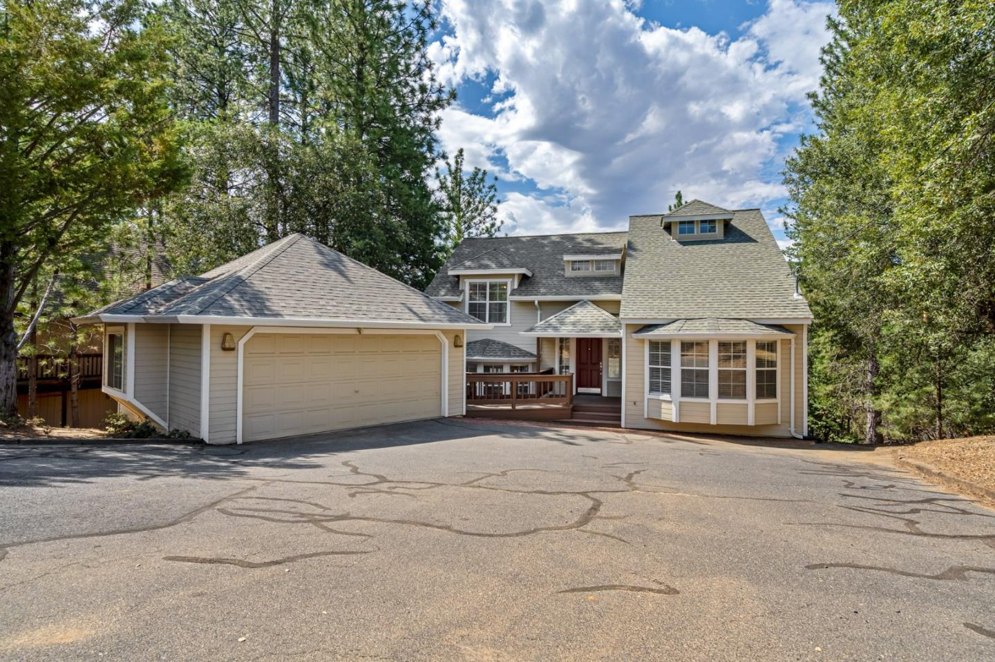 front view of a house with a bench