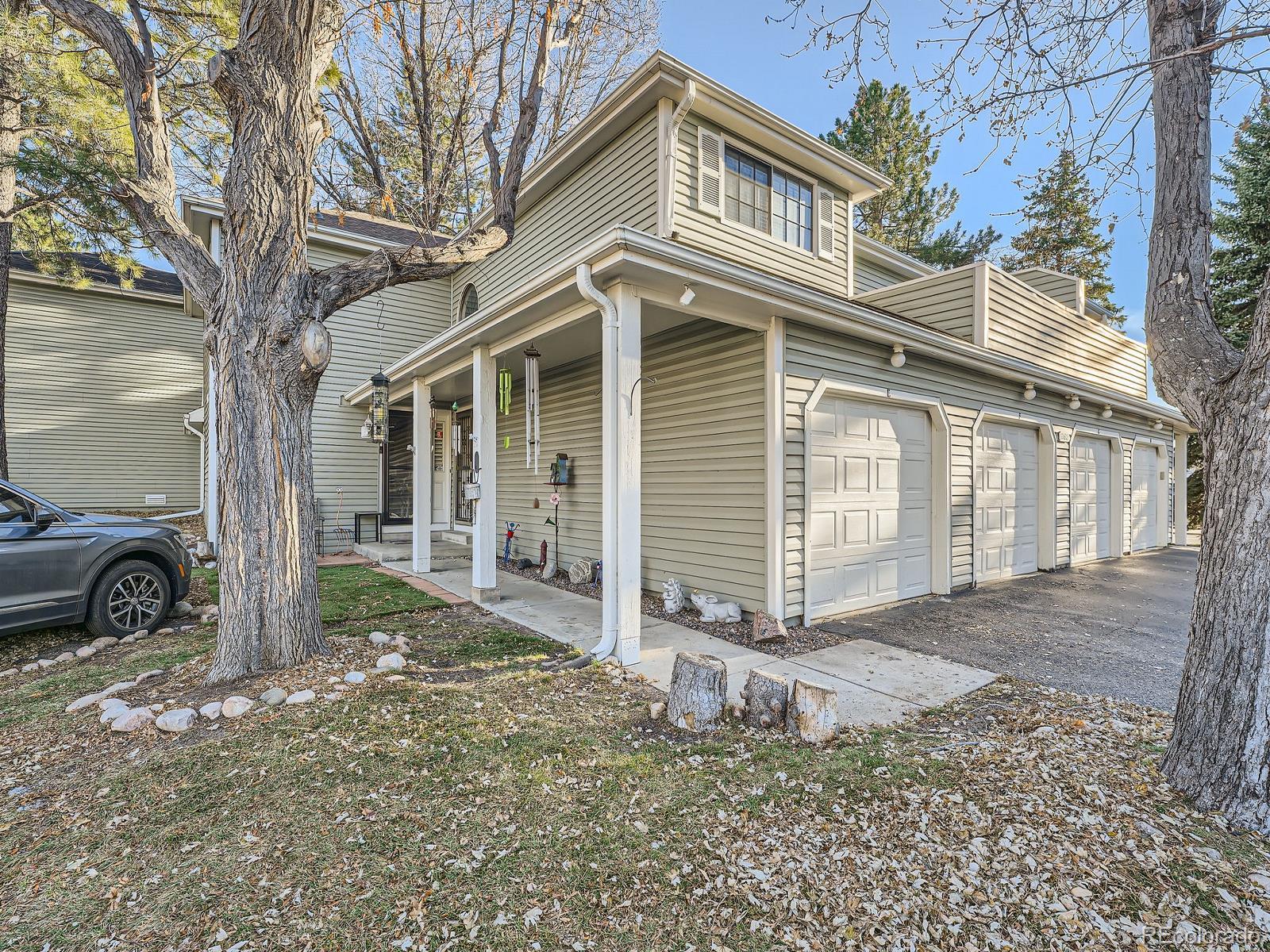 a view of a house with a yard and garage