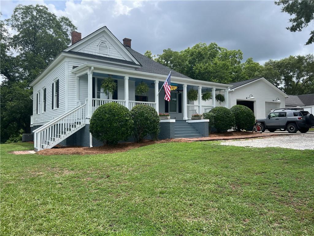 a front view of a house with a yard