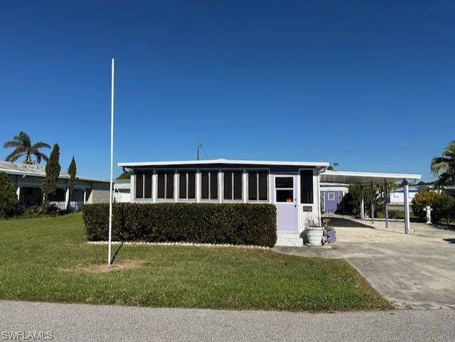 Front of home with attached two car carports.