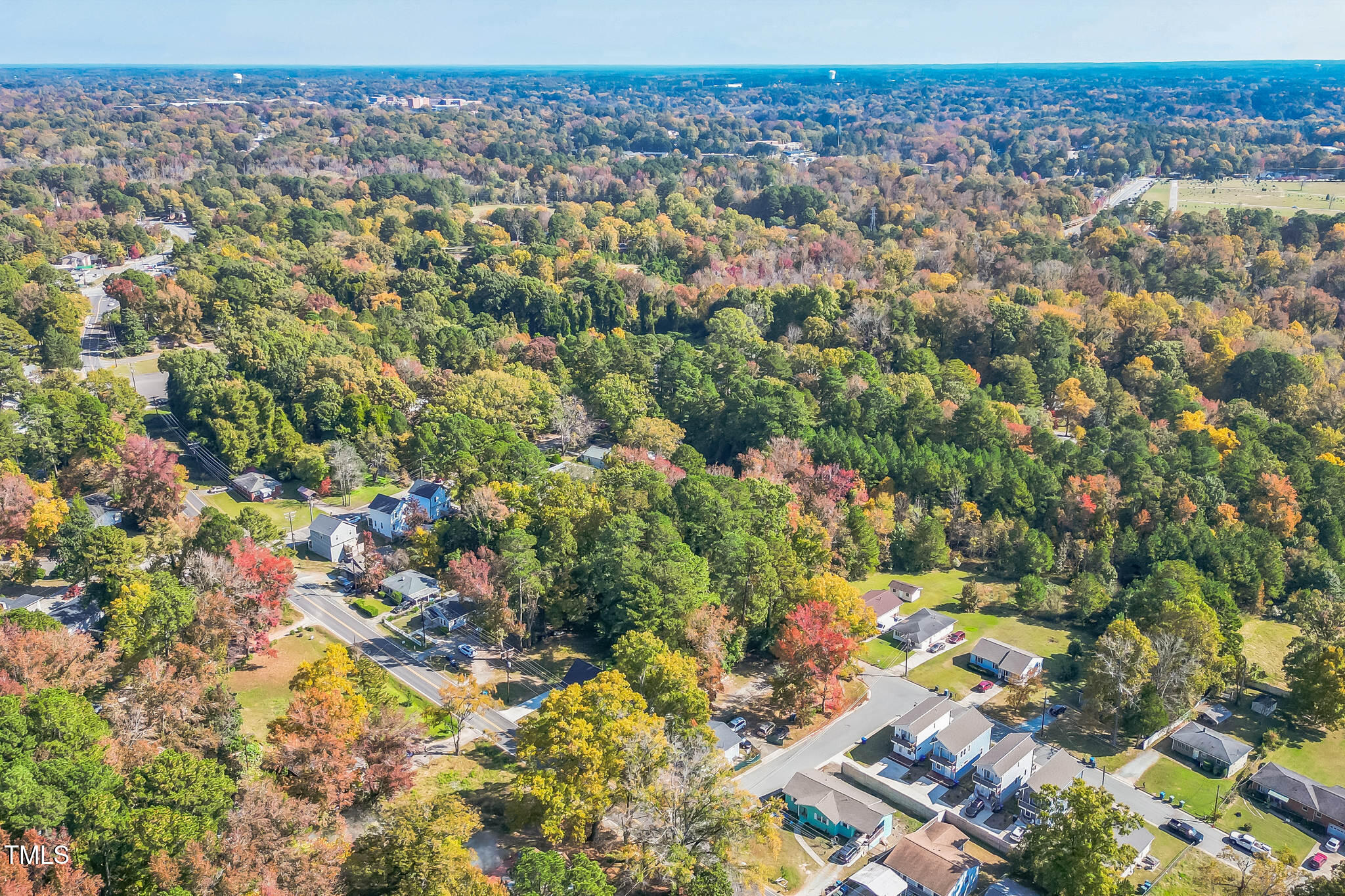 an aerial view of residential houses with outdoor space