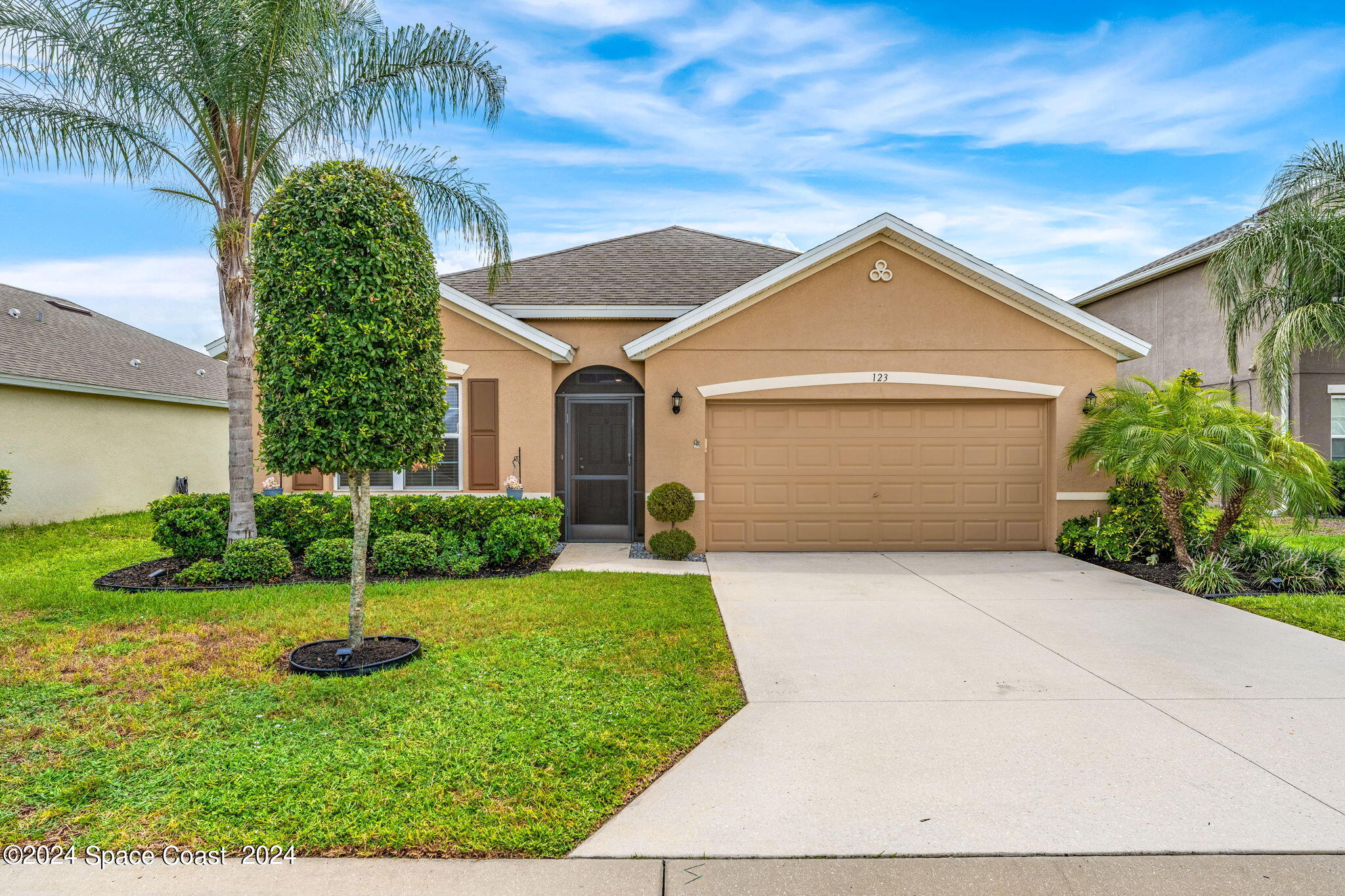 a front view of a house with a yard