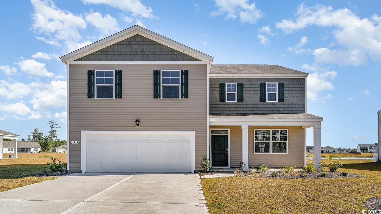 View of front of property featuring a front lawn a