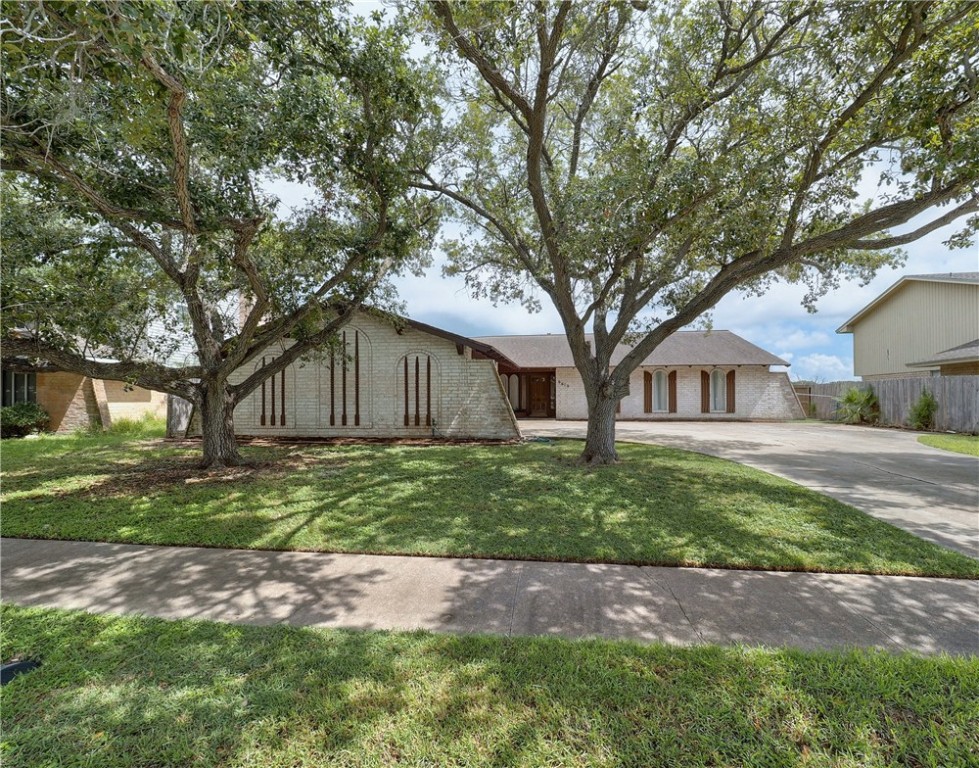 a house with trees in front of it