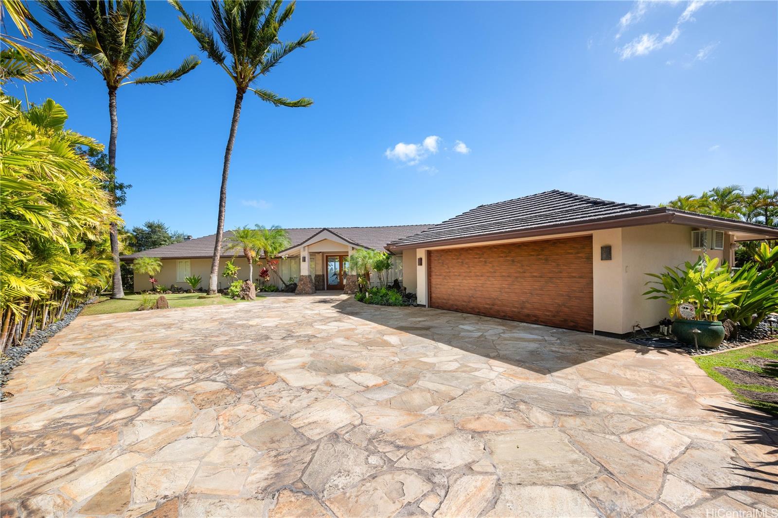 a view of a house with a yard and garage