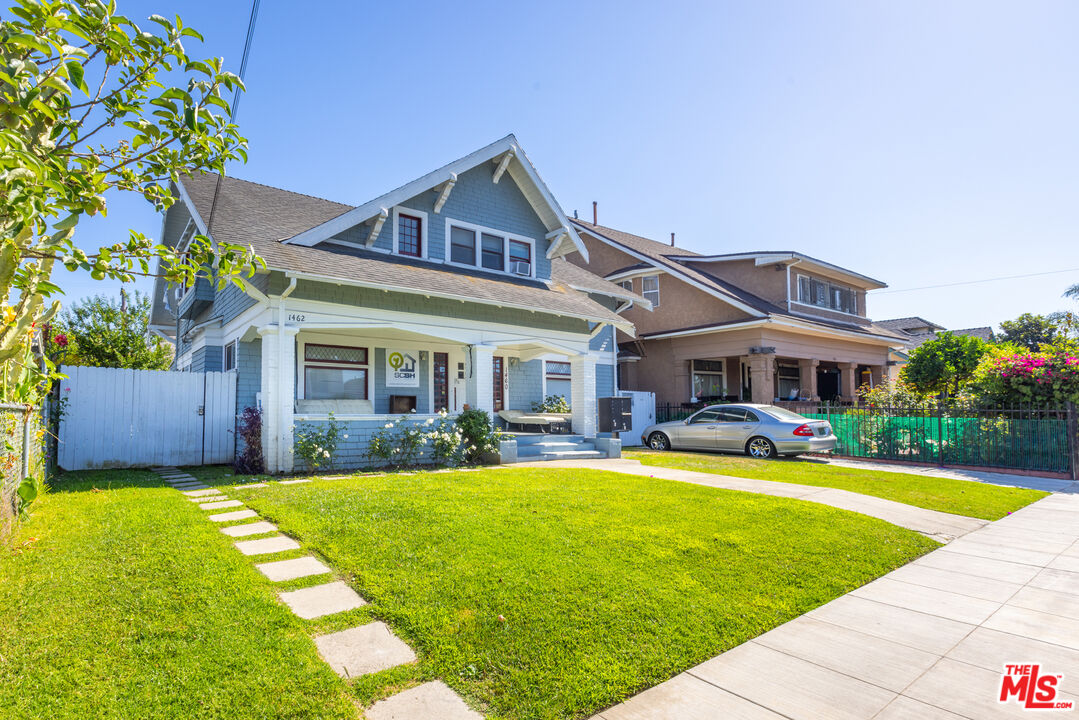 a front view of a house with swimming pool having outdoor seating