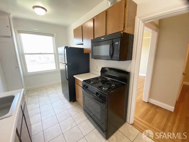 a kitchen with a stove microwave and refrigerator