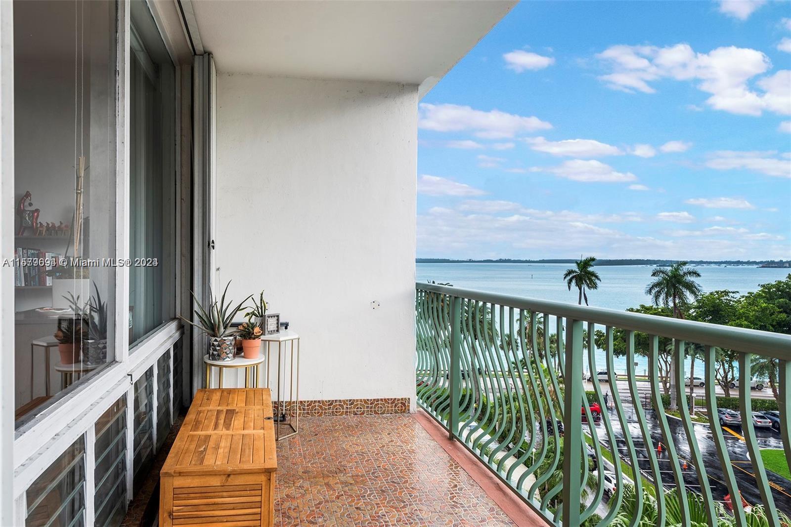 a balcony with view of outdoor space