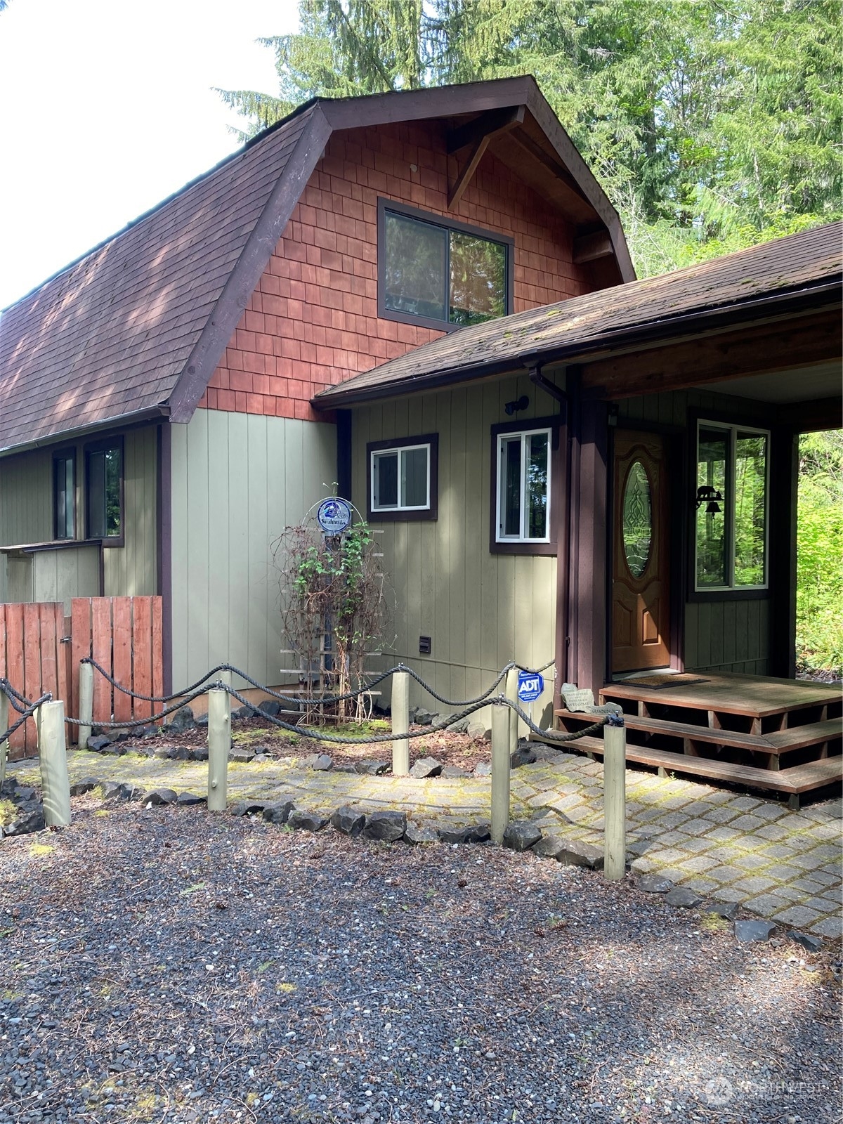 a backyard of a house with barbeque oven