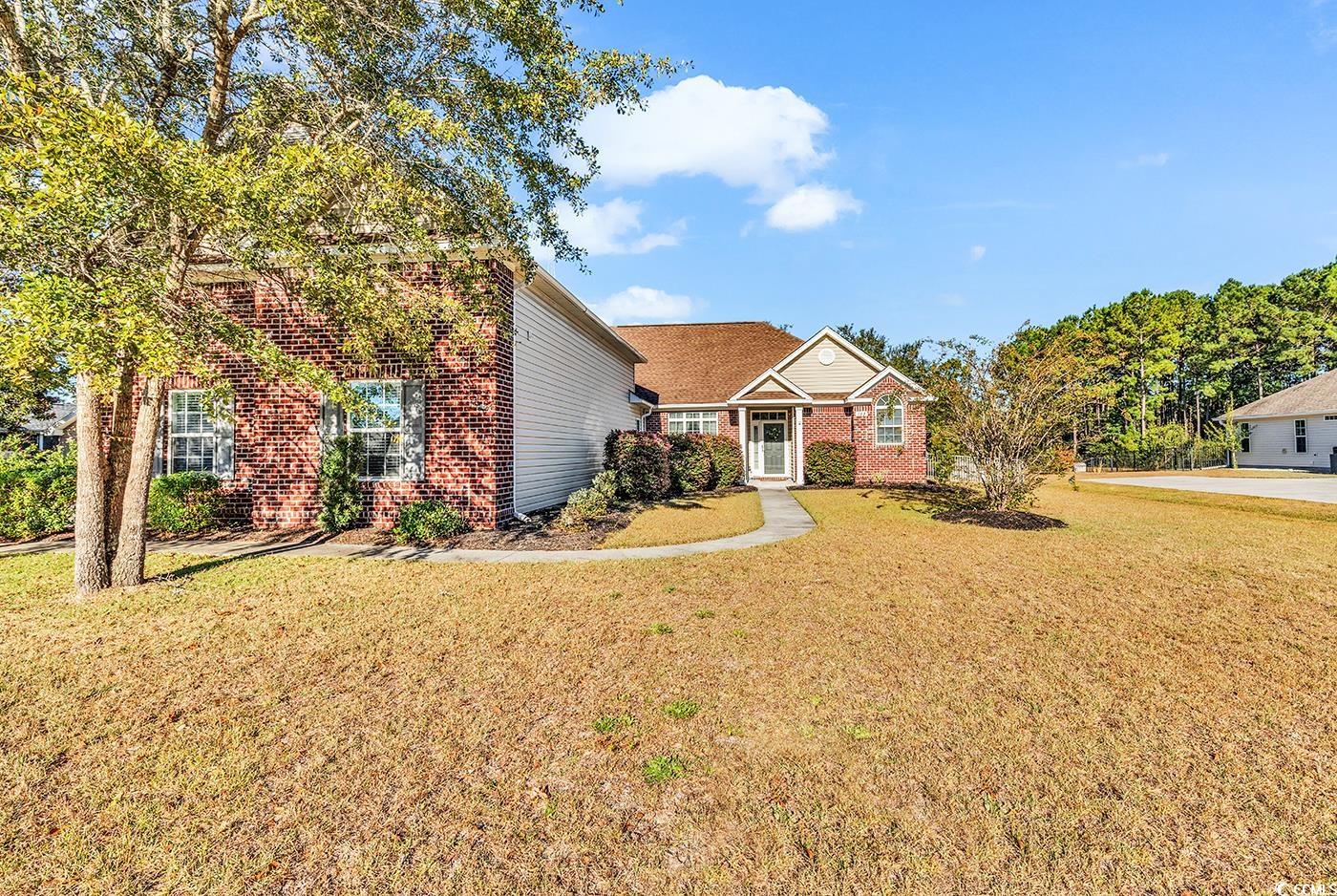 View of front of property with a front yard