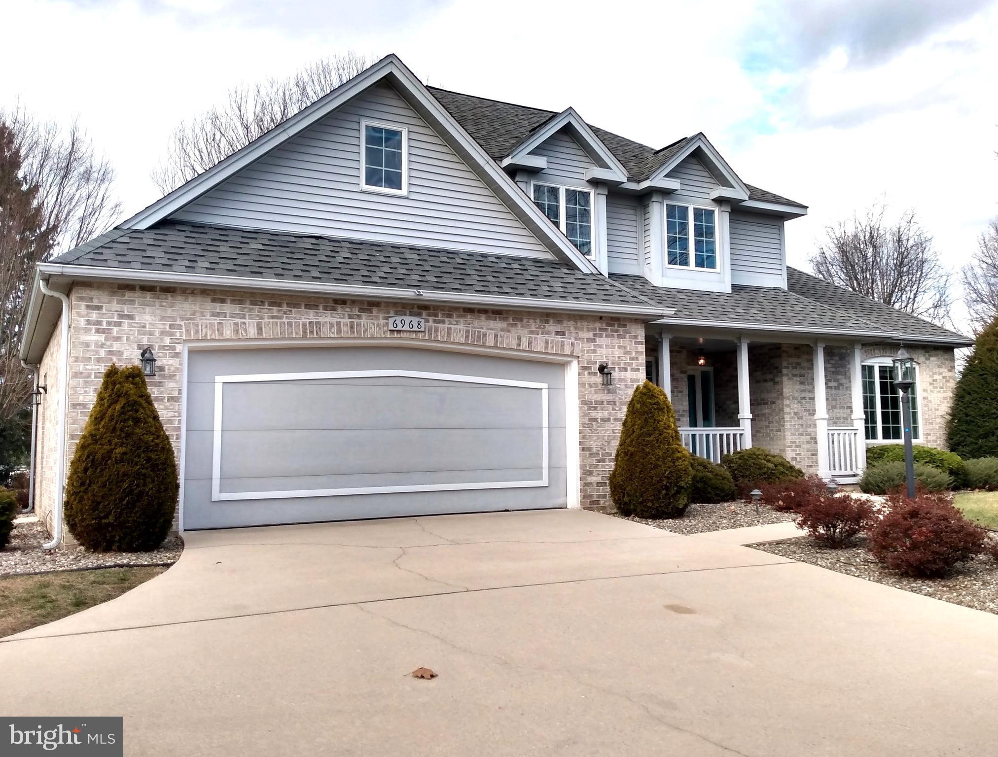 a front view of a house with a garage